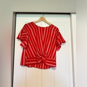 Red top with pattern design great top for spring summer with a pair of shorts